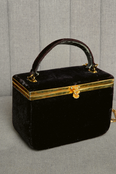 Black Velvet bag with gold metal clasp and shoulder chain.